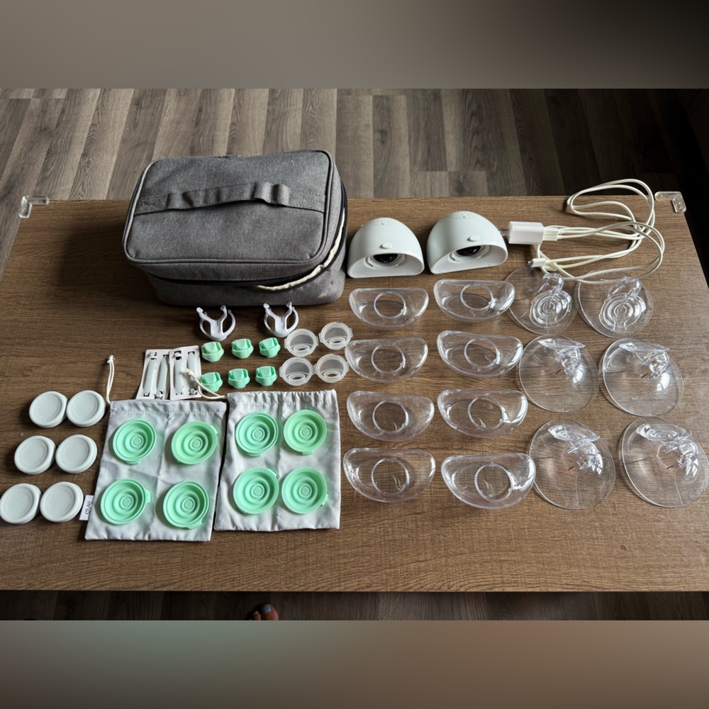 2 Elvie pumps + extra cups/shields/parts + carrying case + chargers